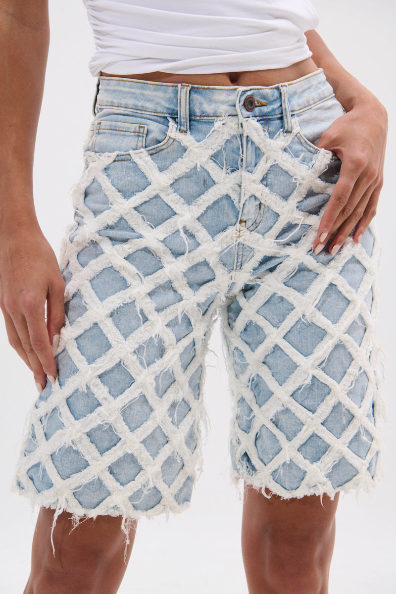 DISTRESSED AND STRESSED DENIM BERMUDA SHORT