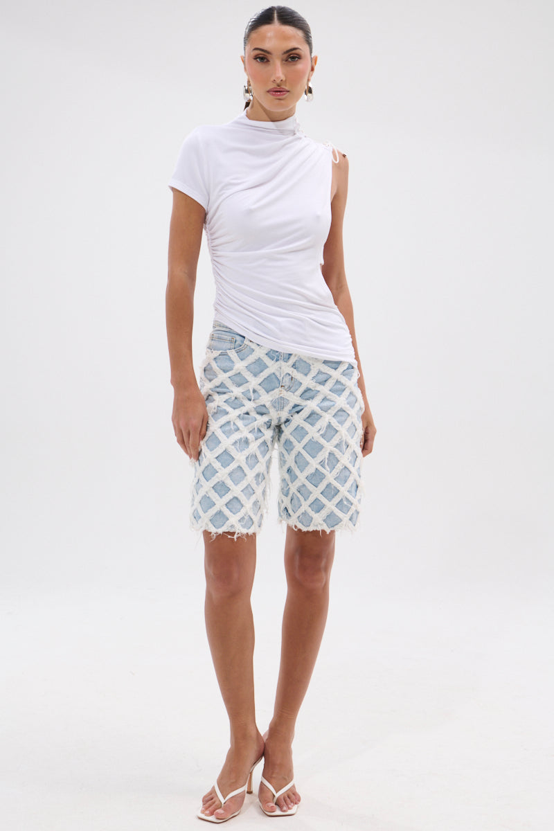 DISTRESSED AND STRESSED DENIM BERMUDA SHORT